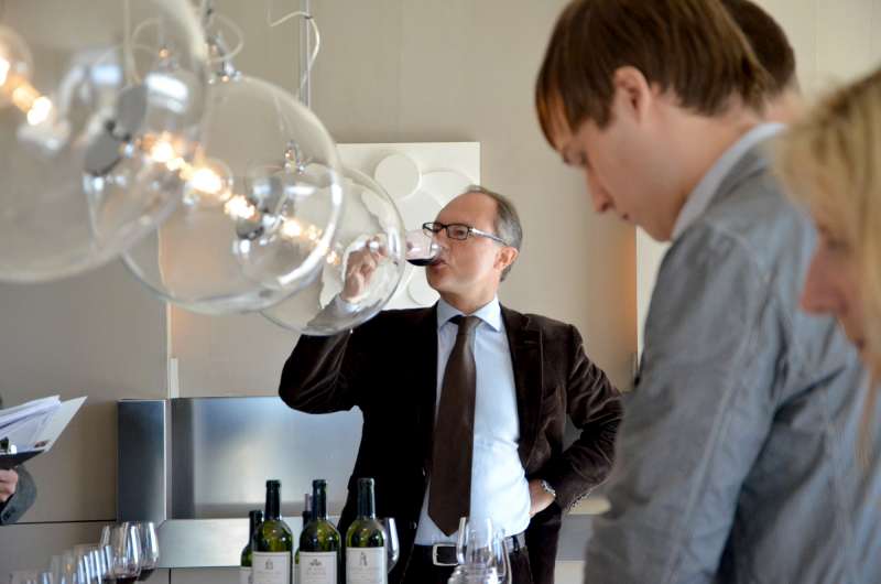 Frederic tastes the 2011 Latour - a wine that Thomas, to the right of the picture, helped to harvest last autumn.