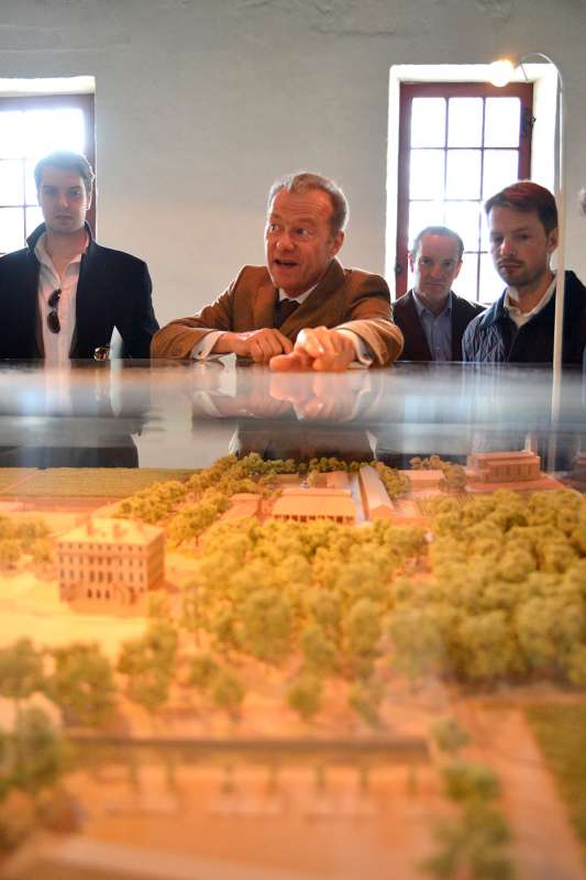 Paul Pontallier shows the team the new construction plans for Château Margaux