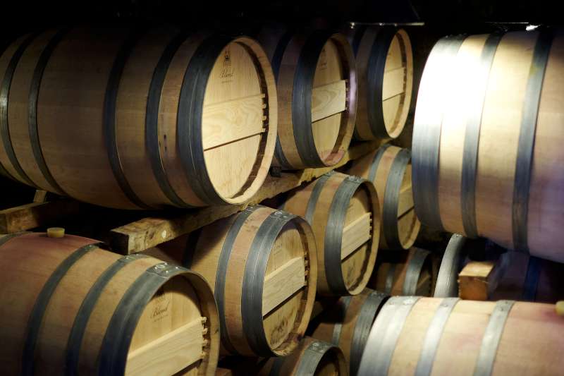 Barrels stacked up at the cosy cellar at Tertre Roteboeuf